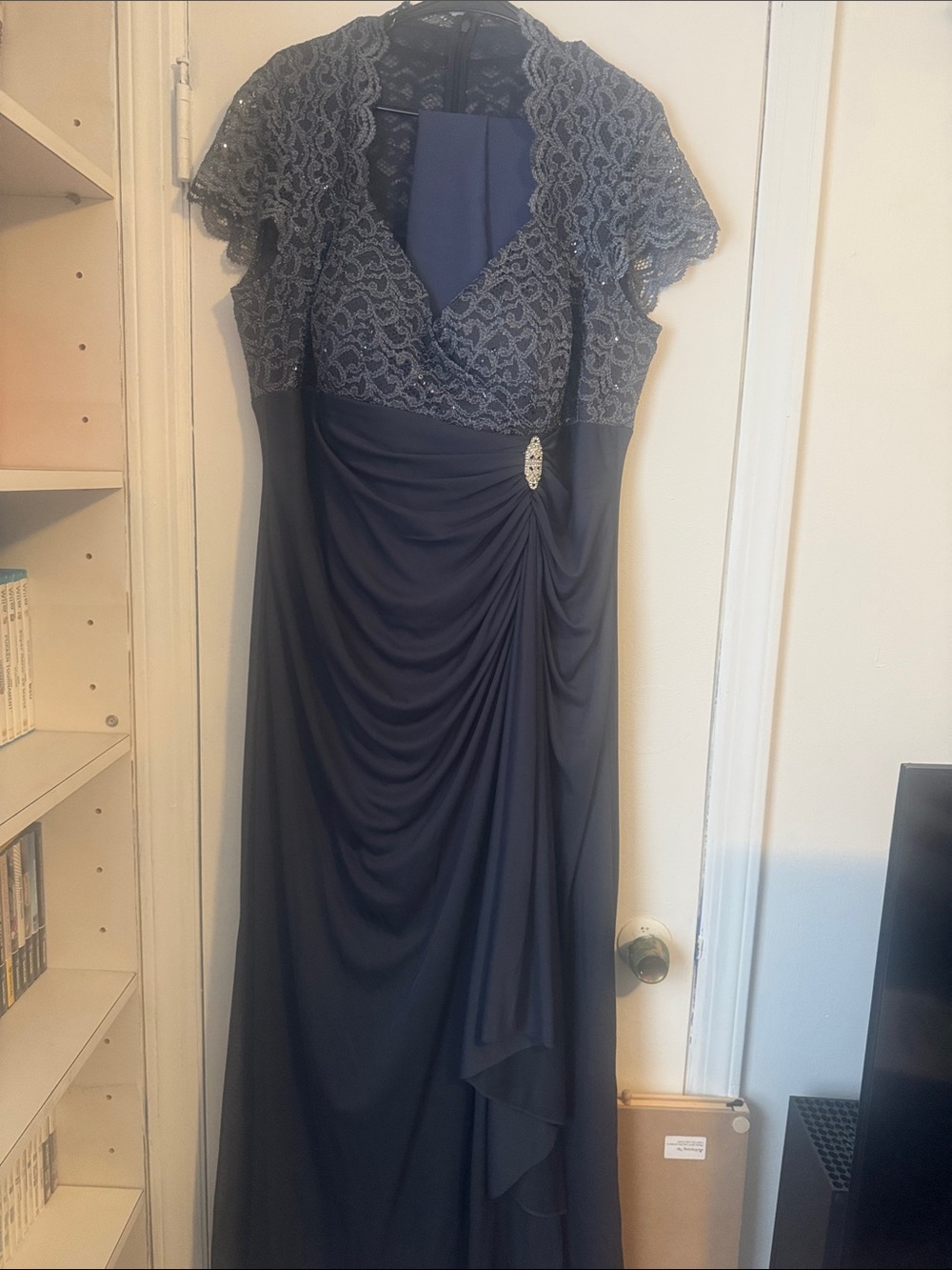 Betsy & Adam Navy Lace Draped Evening Gown with Brooch